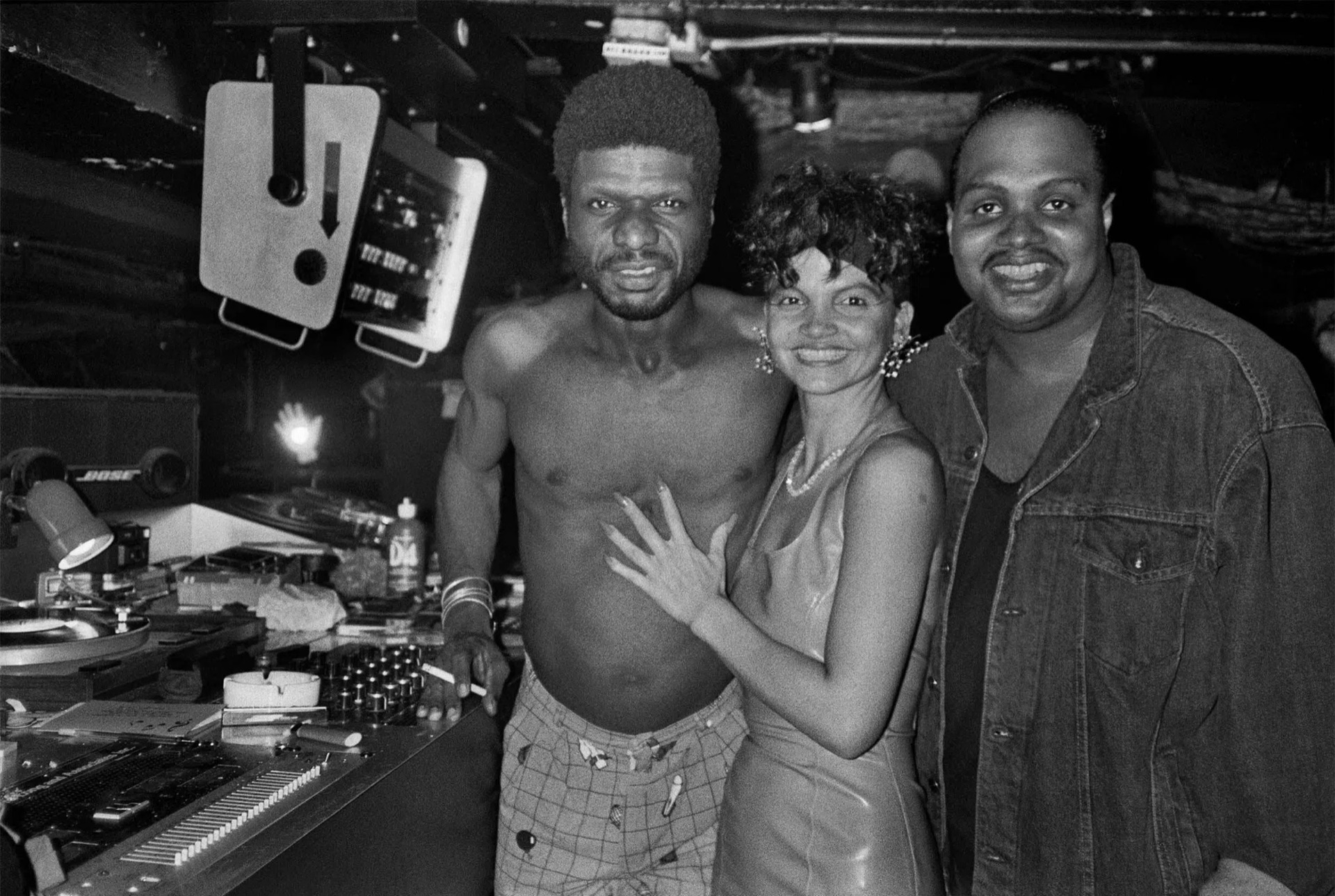 Larry Levan and friends at the Paradise Garage DJ booth.