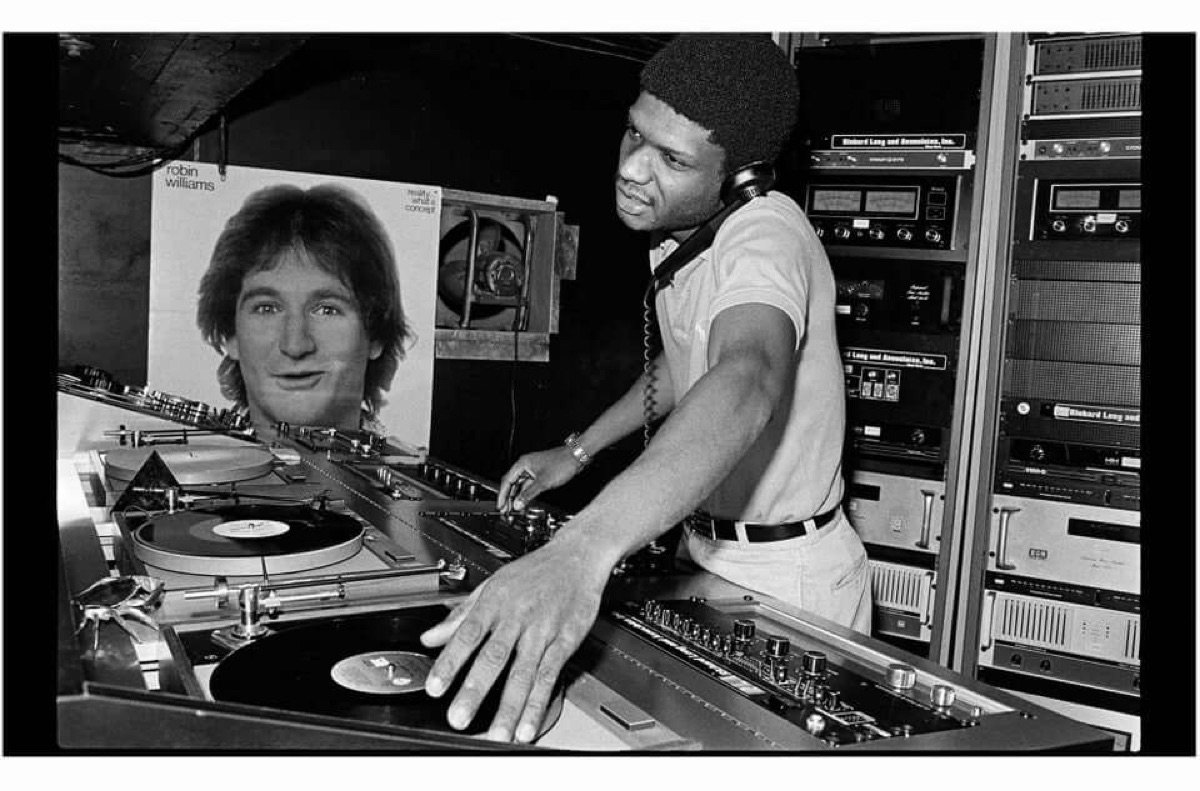 Larry Levan at the Paradise Garage DJ booth, Richard Long sound system in background.